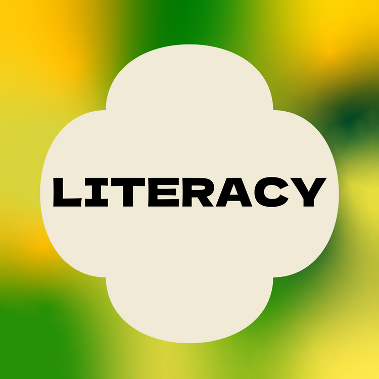 A colourful background of blurred yellow, and green shades with a cream clover-shaped overlay in the centre. Bold black text inside reads ‘LITERACY’.